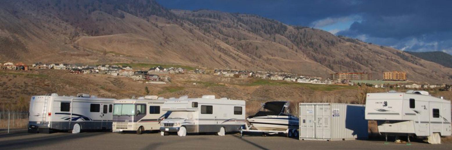 rv and boat storage in kamloops with mountain background